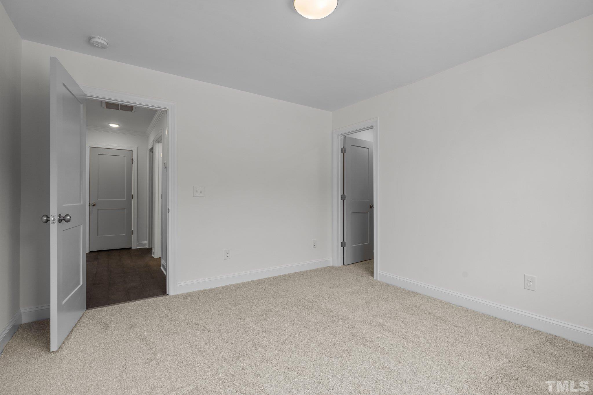 488 Pine Ridge Road Zebulon, NC 27597 - Photo 29 of 47 an empty room with an entryway