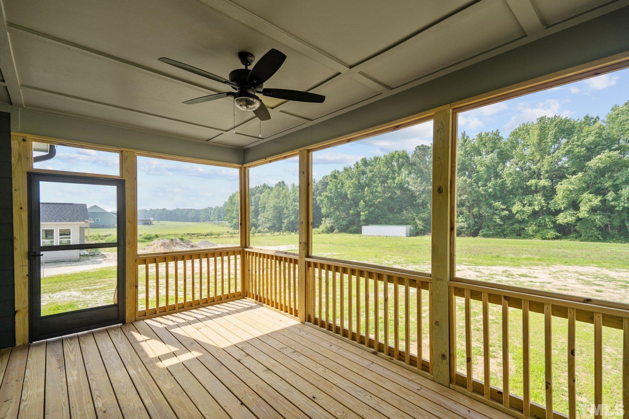 488 Pine Ridge Road Zebulon, NC 27597 - Photo 31 of 47 a view of a balcony with wooden floor