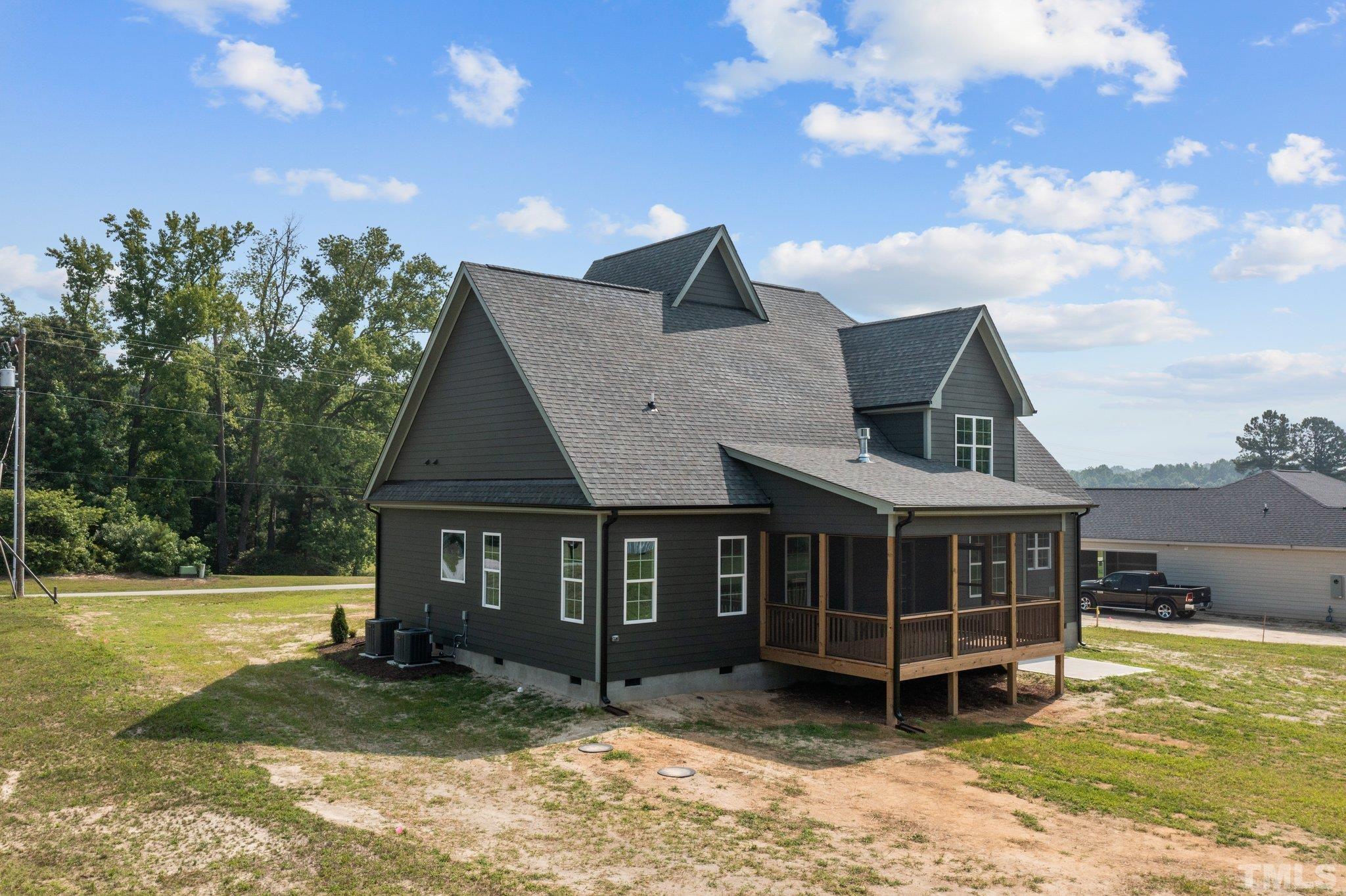 488 Pine Ridge Road Zebulon, NC 27597 - Photo 36 of 47 a view of a house with a yard porch and sitting area