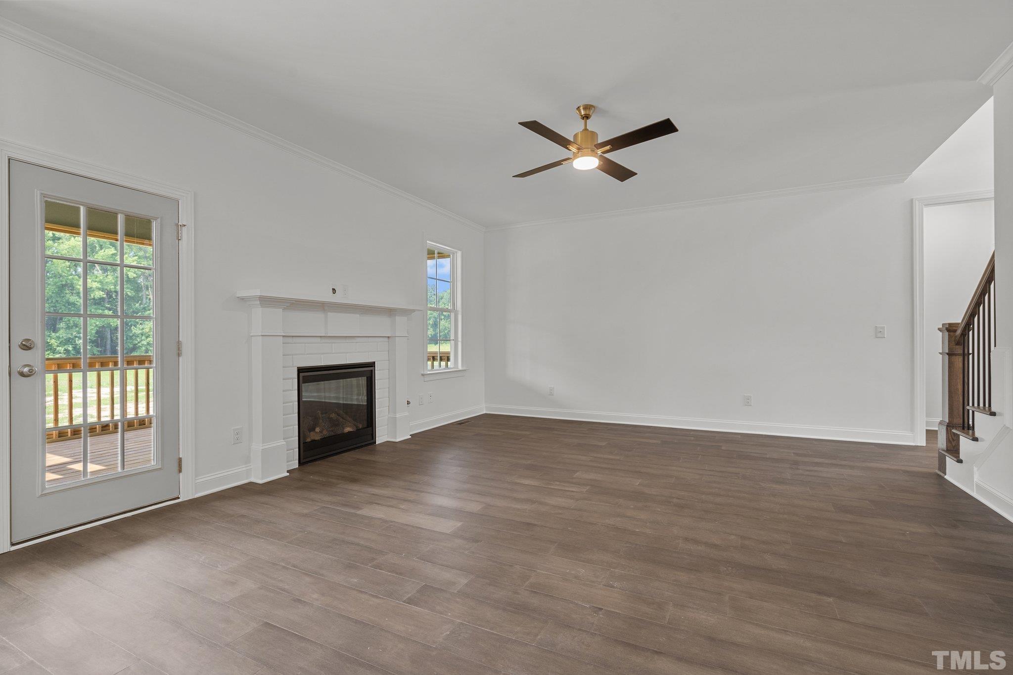 488 Pine Ridge Road Zebulon, NC 27597 - Photo 10 of 47 a view of empty room with a fireplace