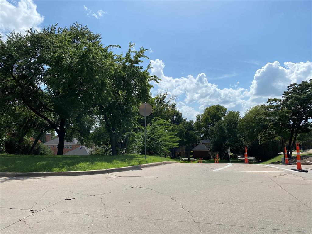 a view of road and trees