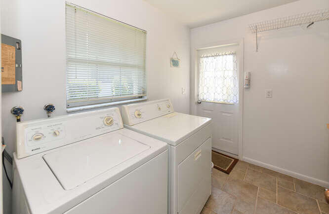 493 Forestview Drive Atlantis, FL 33462 - Photo 15 of 27 a utility room with dryer and washer