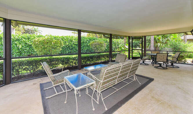 493 Forestview Drive Atlantis, FL 33462 - Photo 16 of 27 a dining room with furniture and a floor to ceiling window