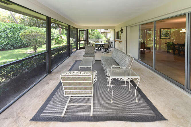 493 Forestview Drive Atlantis, FL 33462 - Photo 18 of 27 a view of a living room and a balcony