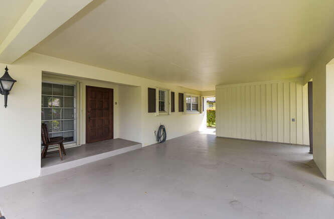 493 Forestview Drive Atlantis, FL 33462 - Photo 2 of 27 a view of an empty room with a window