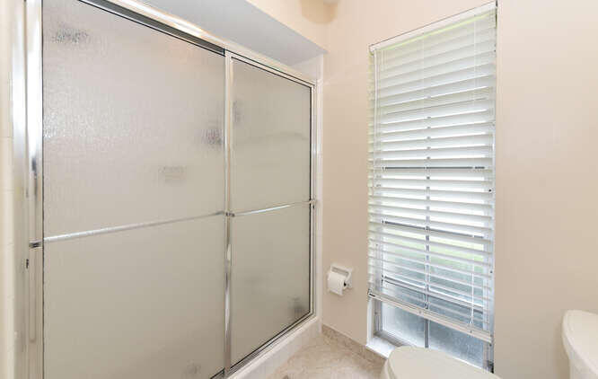 493 Forestview Drive Atlantis, FL 33462 - Photo 22 of 27 a bathroom with a shower
