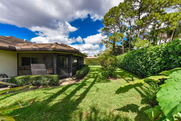 a view of a house with garden and porch