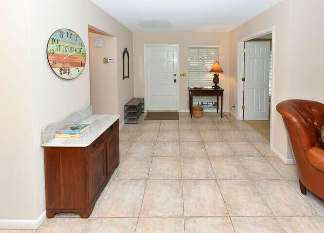 493 Forestview Drive Atlantis, FL 33462 - Photo 6 of 27 a room with furniture and a window