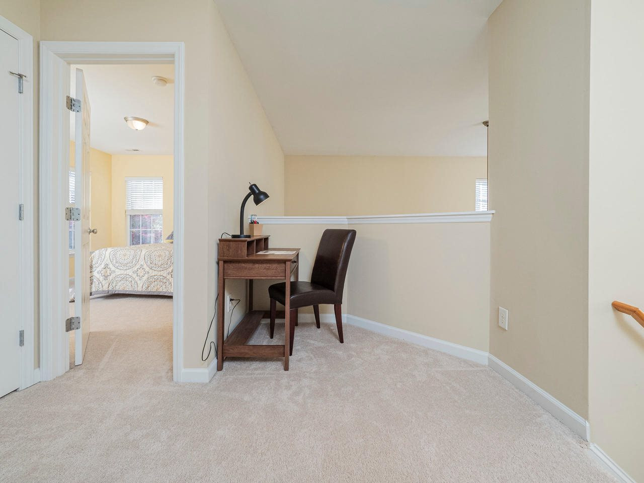 8429 Whisper Ridge Place Raleigh, NC 27613 - Photo 17 of 27 Upstairs you'll find this perfect little reading nook in the open landing area