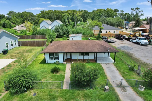 an aerial view of a house with garden