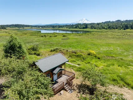 a view of a lake with a yard