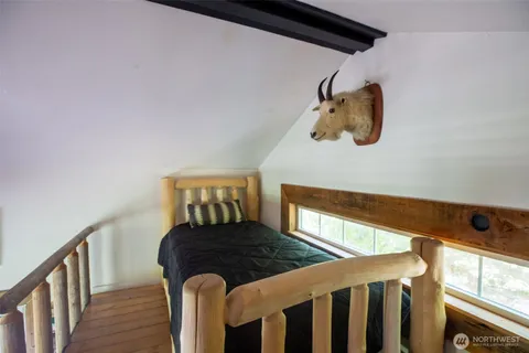 a view of a living room and wooden floor