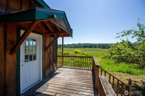 a view of a two chairs on the roof deck