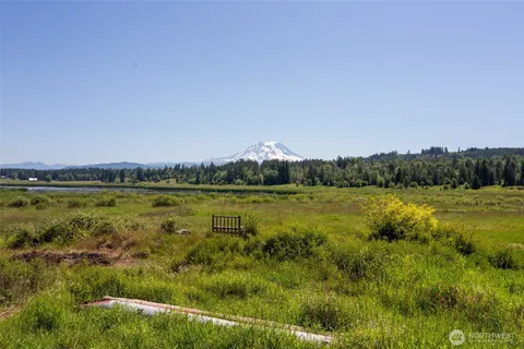 a view of a lake with houses in the back