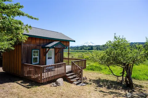 a view of a chair and table in the patio