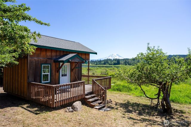 a view of a chair and table in the patio