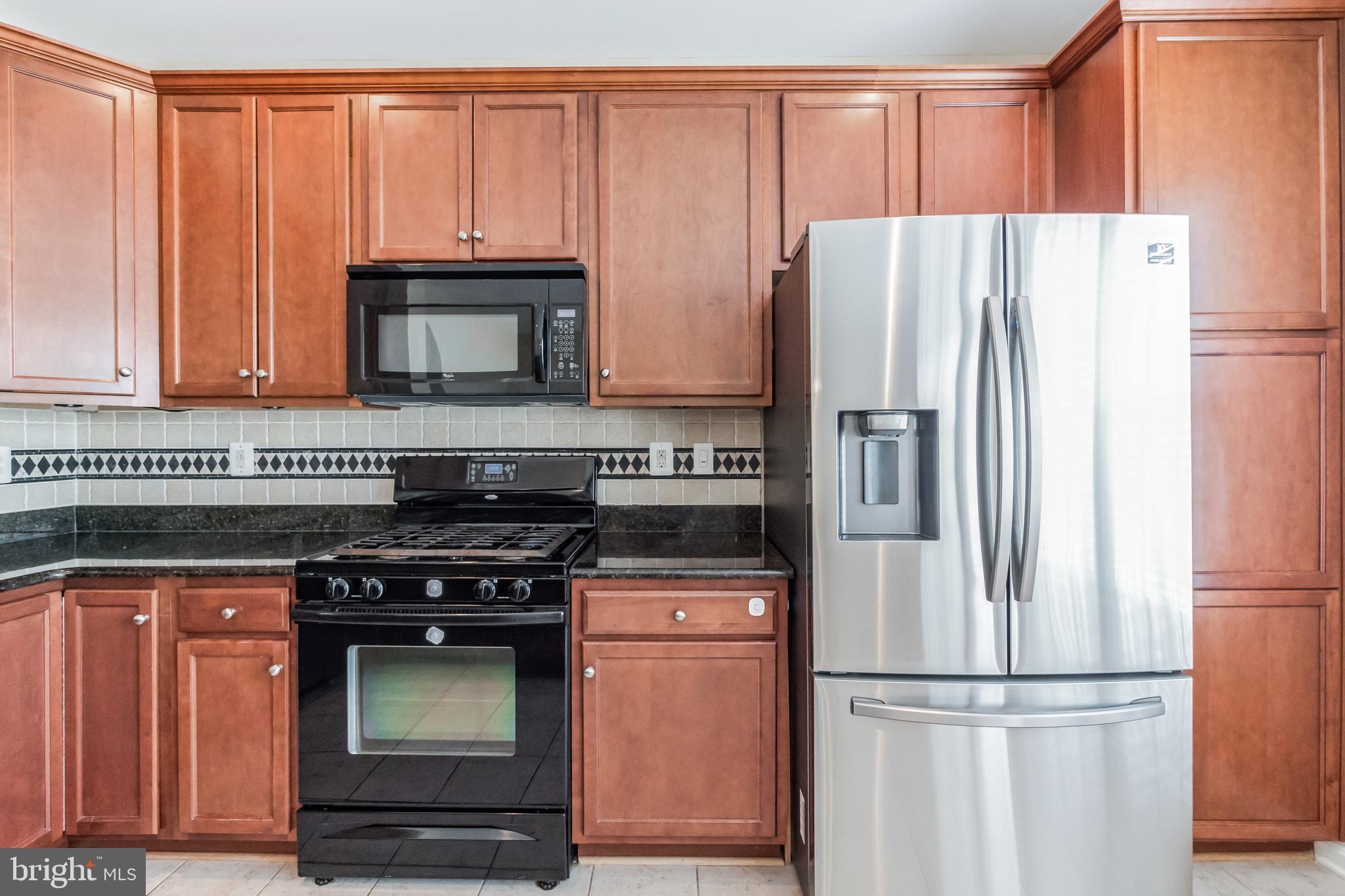 1834 Monocacy View Circle, Unit 53B Frederick, MD 21701 - Photo 12 of 30 a kitchen with appliances and cabinets