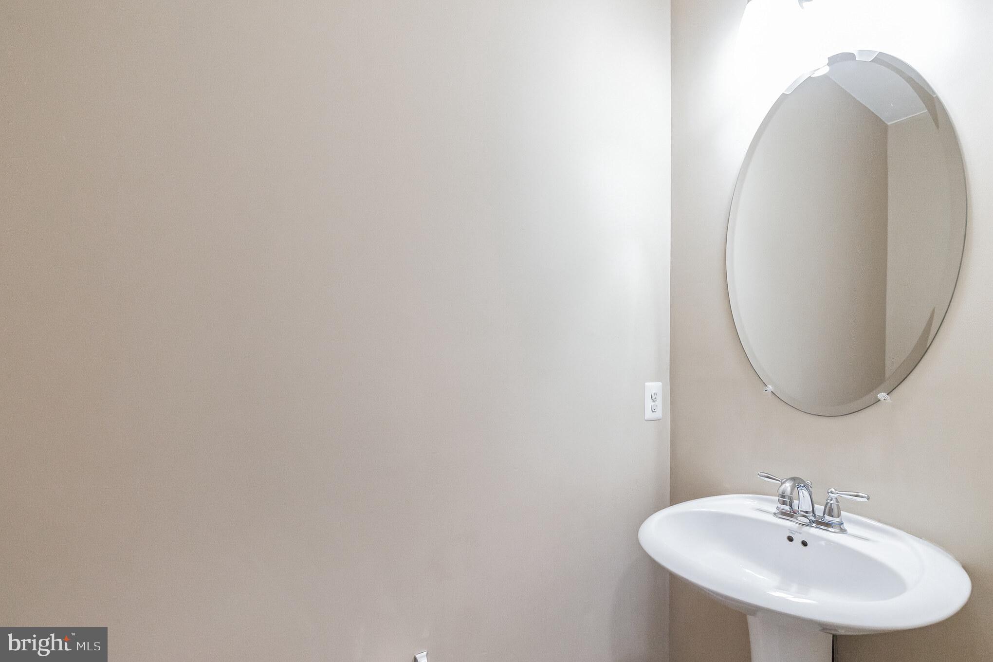 1834 Monocacy View Circle, Unit 53B Frederick, MD 21701 - Photo 13 of 30 a bathroom with a sink and a mirror