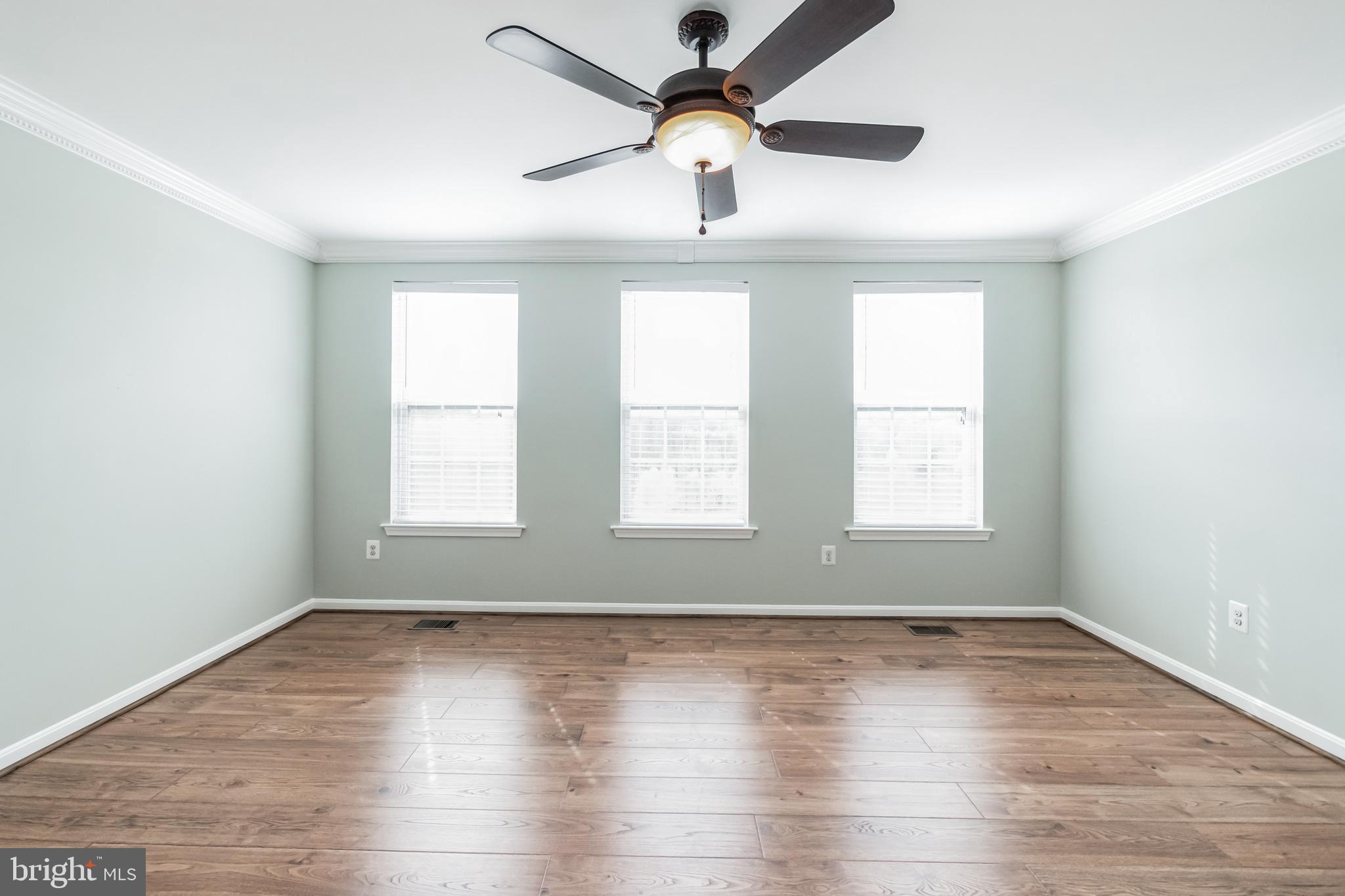 1834 Monocacy View Circle, Unit 53B Frederick, MD 21701 - Photo 16 of 30 wooden floor in an empty room with a window