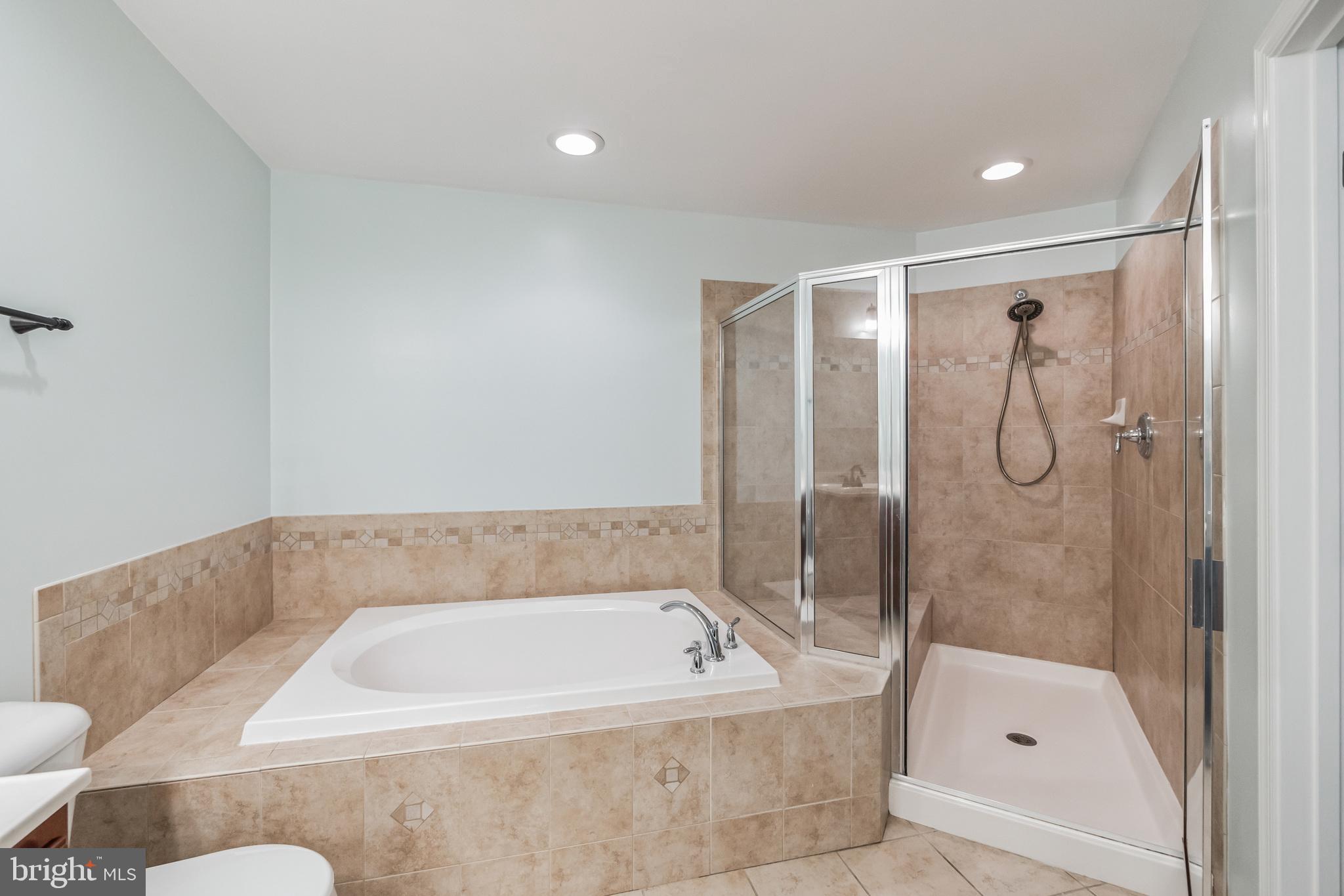 1834 Monocacy View Circle, Unit 53B Frederick, MD 21701 - Photo 18 of 30 a bathroom with a tub and shower