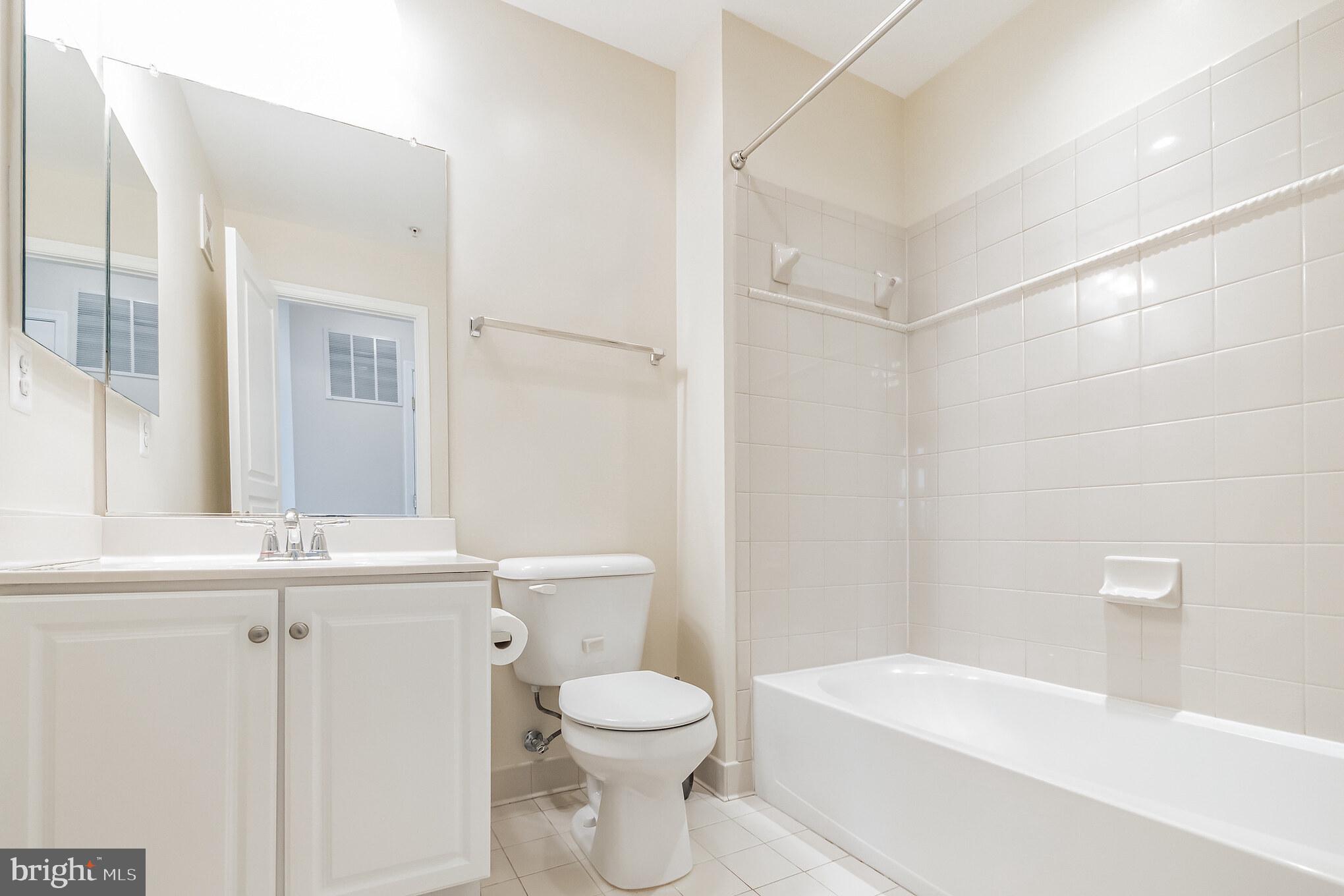 1834 Monocacy View Circle, Unit 53B Frederick, MD 21701 - Photo 21 of 30 a bathroom with a toilet a sink and a bathtub