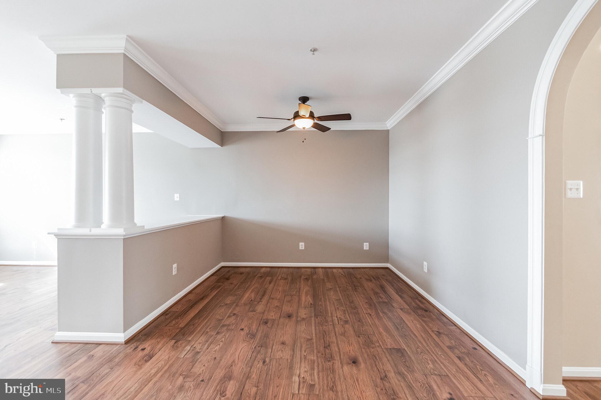 1834 Monocacy View Circle, Unit 53B Frederick, MD 21701 - Photo 4 of 30 a view of a room with wooden floors and ceiling fan