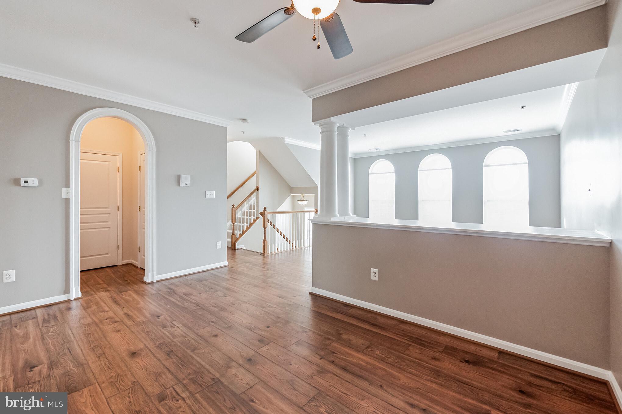 1834 Monocacy View Circle, Unit 53B Frederick, MD 21701 - Photo 6 of 30 wooden floor in an empty room with a window