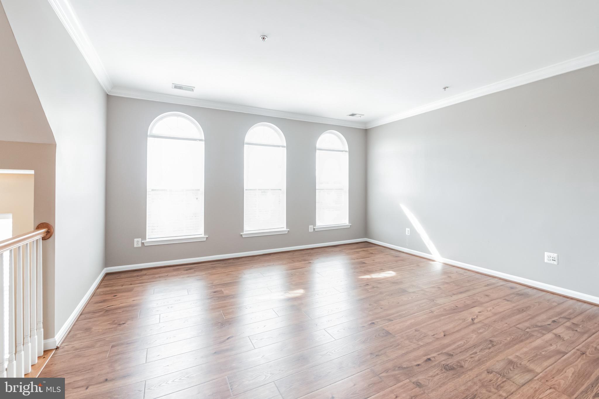 1834 Monocacy View Circle, Unit 53B Frederick, MD 21701 - Photo 7 of 30 wooden floor in an empty room with a window