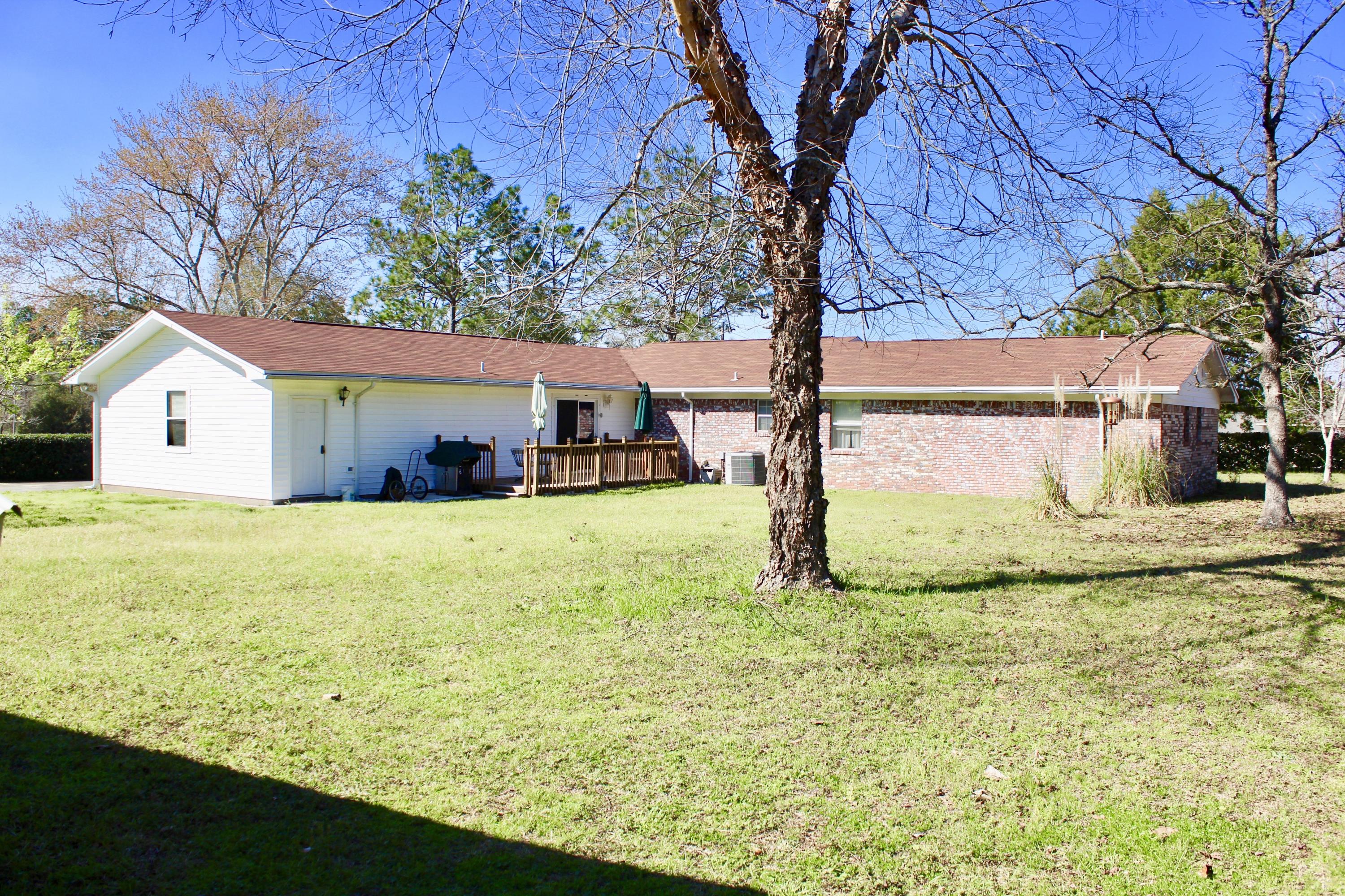 3646 Poverty Creek Road Crestview, FL 32539 - Photo 4 of 37 a view of a house with a yard