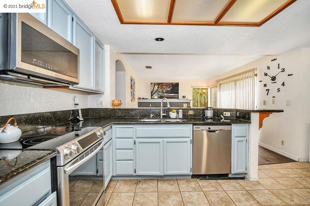 4873 Ridgeview Drive Antioch, CA 94531 - Photo 1 of 1 Kitchen with marbel counter tops and stainless steel appliances