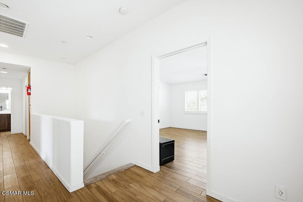 1909 Taormina Court Riverside, CA 92507 - Photo 16 of 58 a view of hallway with wooden floor