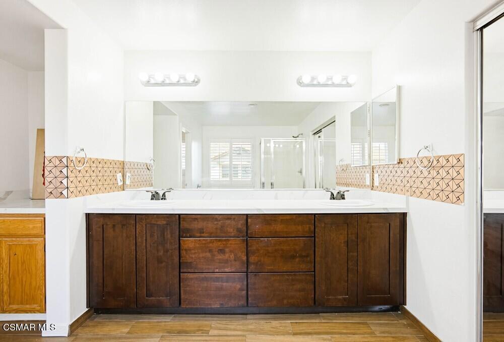 1909 Taormina Court Riverside, CA 92507 - Photo 22 of 58 a bathroom with a sink double vanity and a mirror