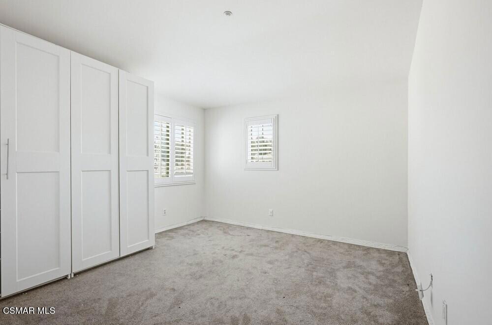 1909 Taormina Court Riverside, CA 92507 - Photo 25 of 58 an empty room with windows