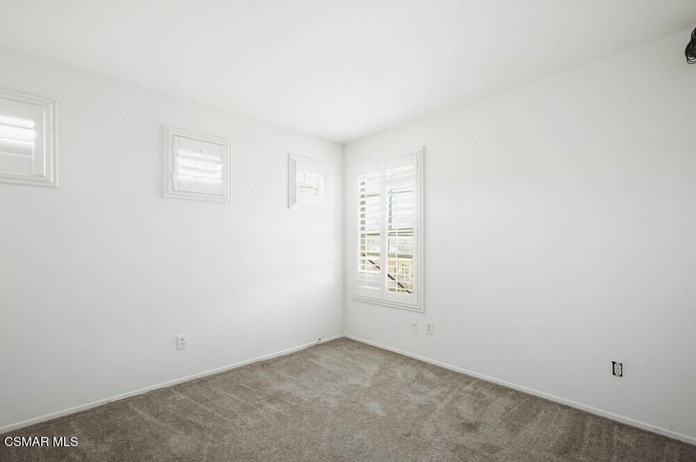 1909 Taormina Court Riverside, CA 92507 - Photo 27 of 58 an empty room with windows