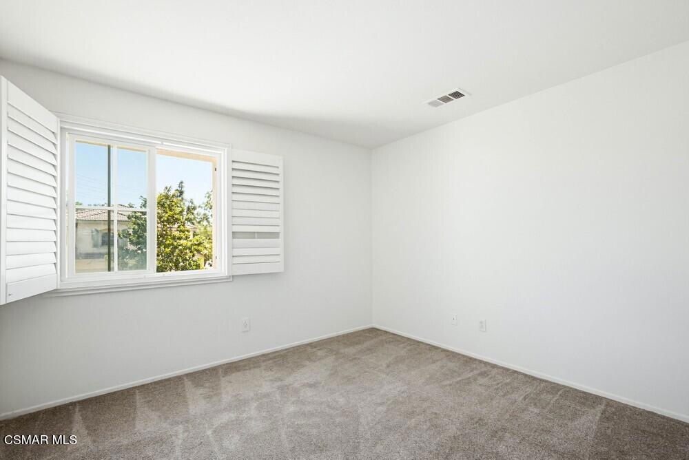 1909 Taormina Court Riverside, CA 92507 - Photo 29 of 58 an empty room with windows