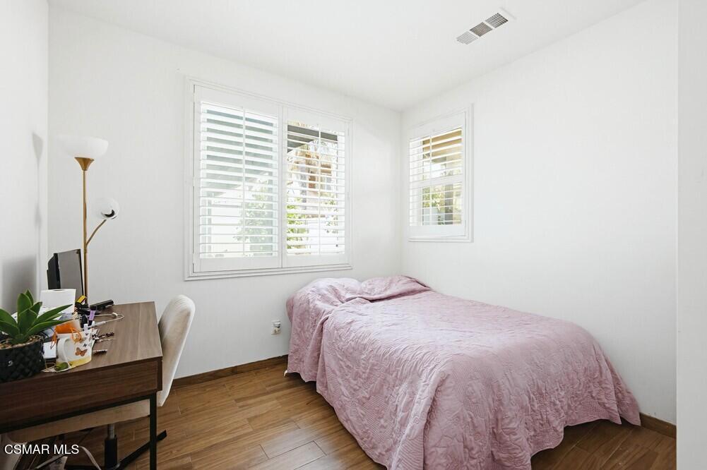 1909 Taormina Court Riverside, CA 92507 - Photo 39 of 58 a bedroom with a bed and a window