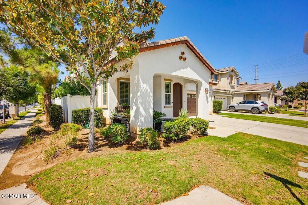 1909 Taormina Court Riverside, CA 92507 - Photo 4 of 58 a front view of a house with a yard
