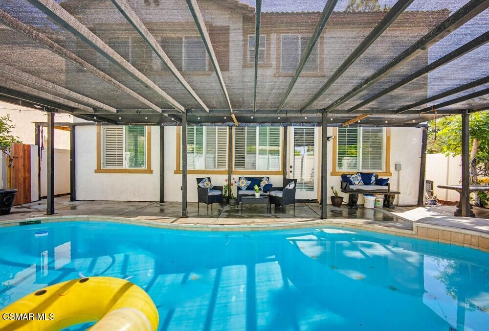 1909 Taormina Court Riverside, CA 92507 - Photo 49 of 58 a living room with furniture floor to ceiling window and pool table