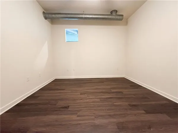 a view of a kitchen with a wooden floor
