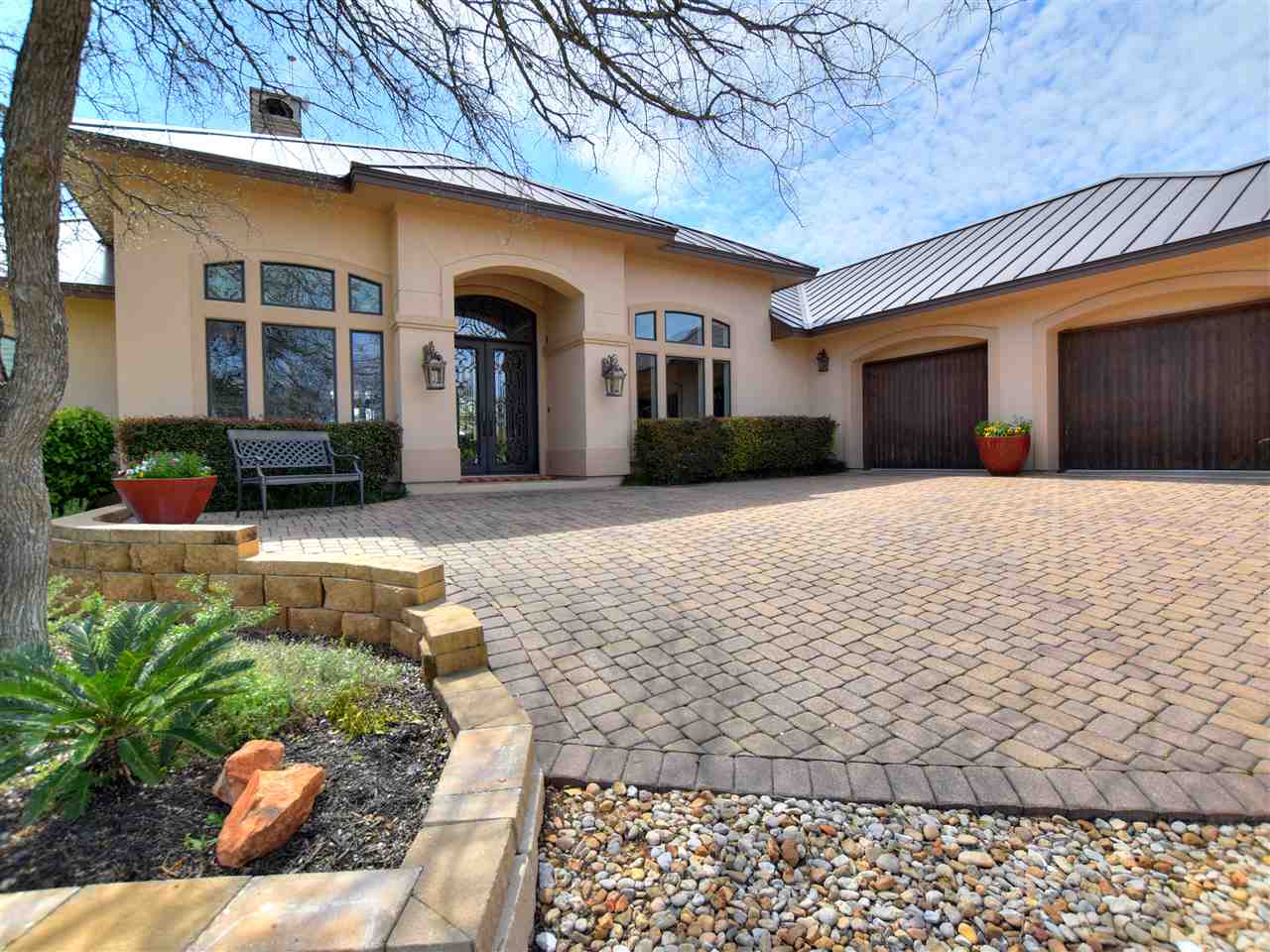 700 Hawk Shadow Horseshoe Bay, TX 78657 - Photo 1 of 1 a front view of a house with a yard outdoor seating and barbeque oven