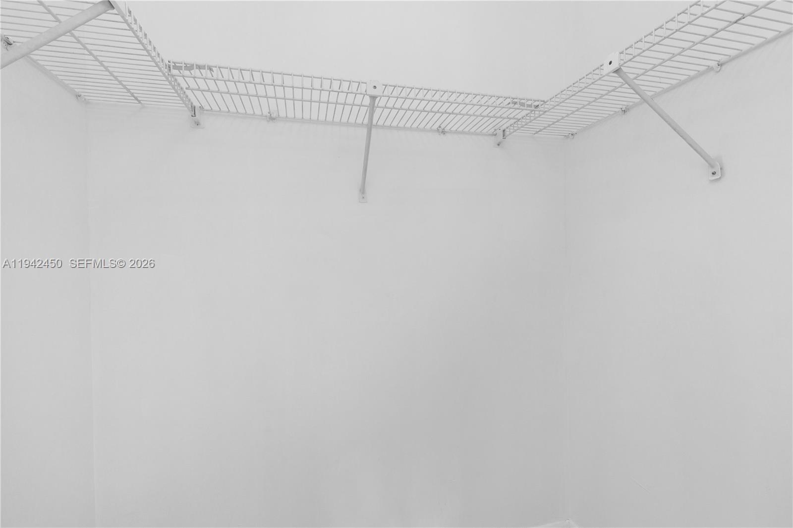 8810 Southwest 132nd Place, Unit 403DN Miami, FL 33186 - Photo 12 of 21 a view of a rack on the wall
