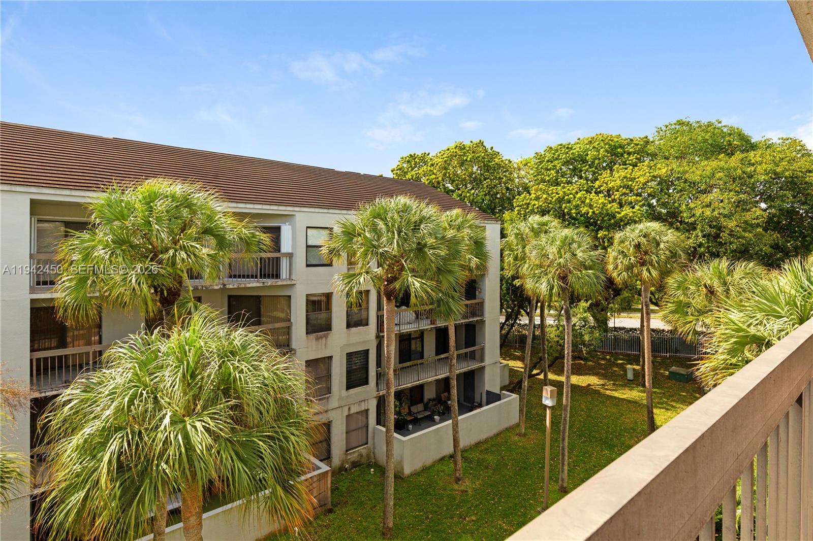 8810 Southwest 132nd Place, Unit 403DN Miami, FL 33186 - Photo 12 of 29 a view of balcony with plants
