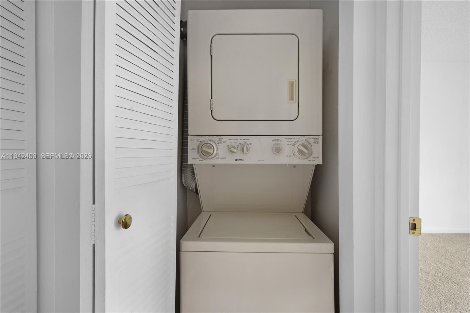 8810 Southwest 132nd Place, Unit 403DN Miami, FL 33186 - Photo 14 of 21 a utility room with dryer and washer
