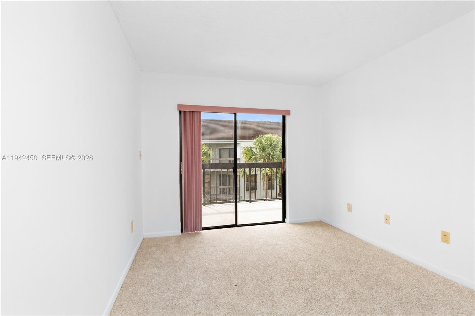 8810 Southwest 132nd Place, Unit 403DN Miami, FL 33186 - Photo 16 of 29 a view of an empty room with a window