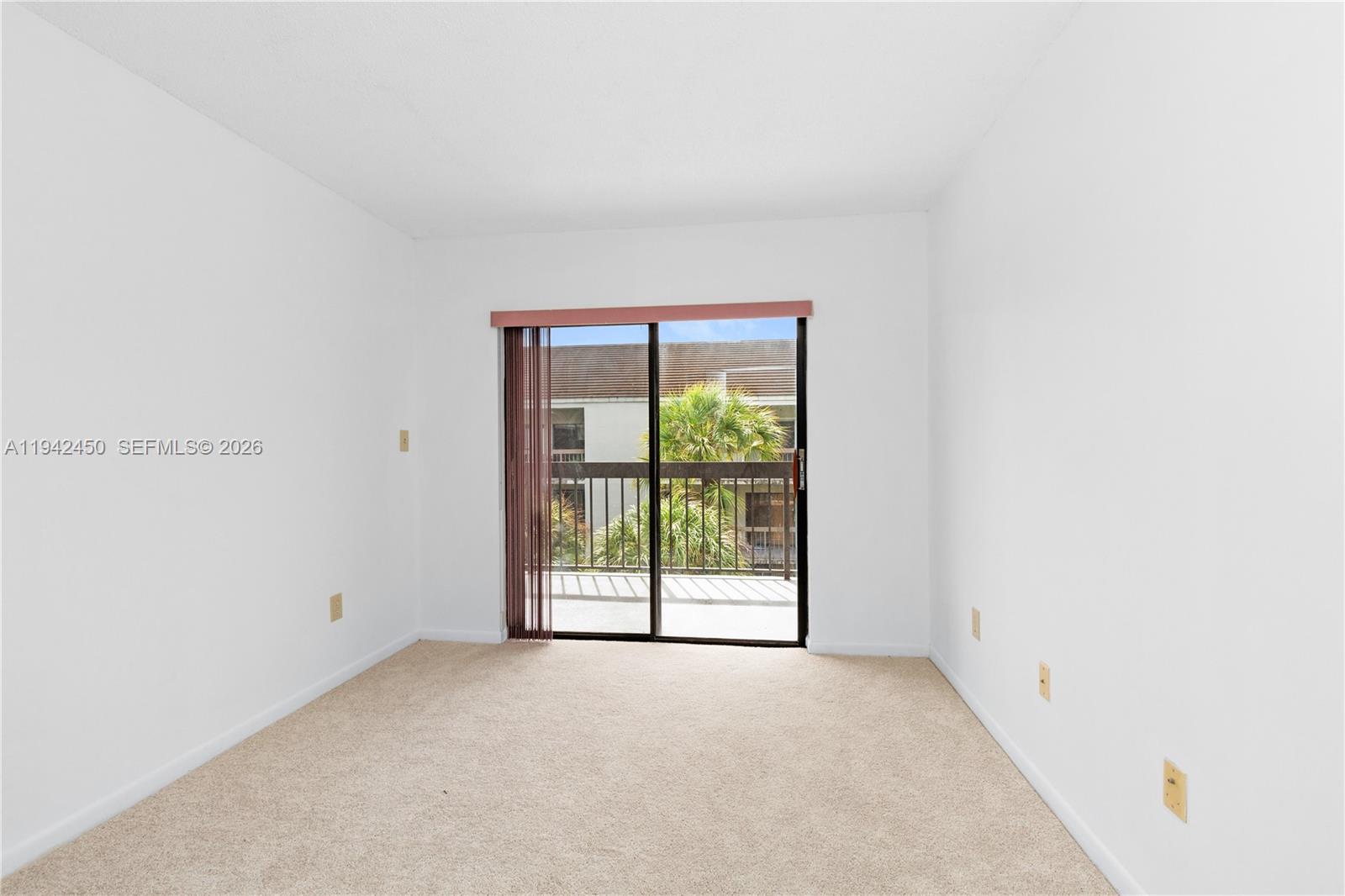 8810 Southwest 132nd Place, Unit 403DN Miami, FL 33186 - Photo 17 of 29 a view of an empty room with a window