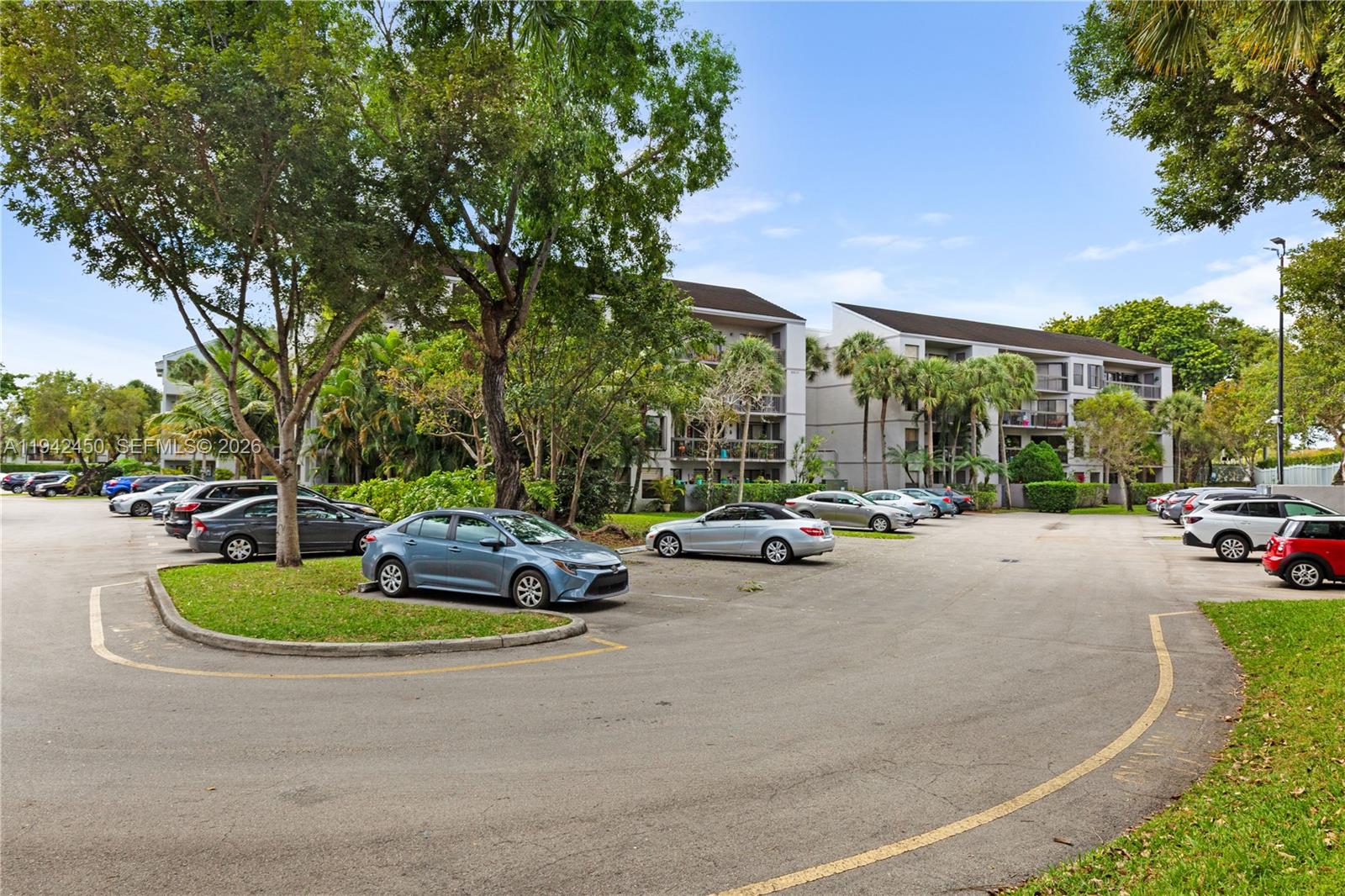 8810 Southwest 132nd Place, Unit 403DN Miami, FL 33186 - Photo 28 of 29 a view of street with parked cars