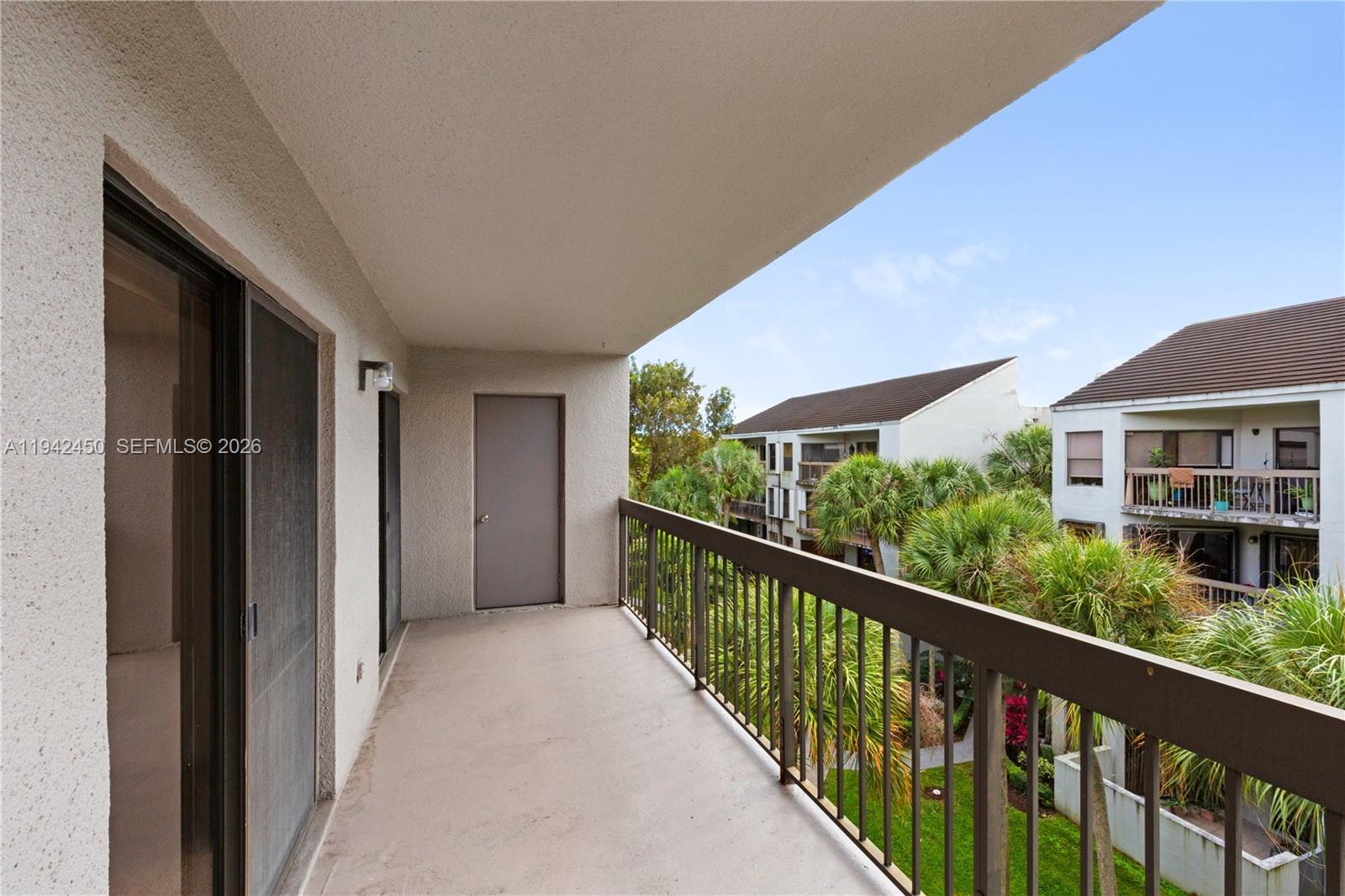 8810 Southwest 132nd Place, Unit 403DN Miami, FL 33186 - Photo 8 of 21 a view of balcony