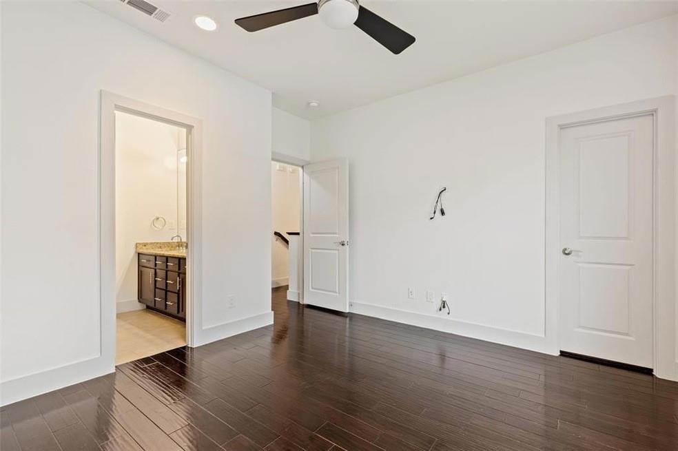 5924 Hudson Street, Unit F Dallas, TX 75206 - Photo 17 of 25 wooden floor in an empty room with a window
