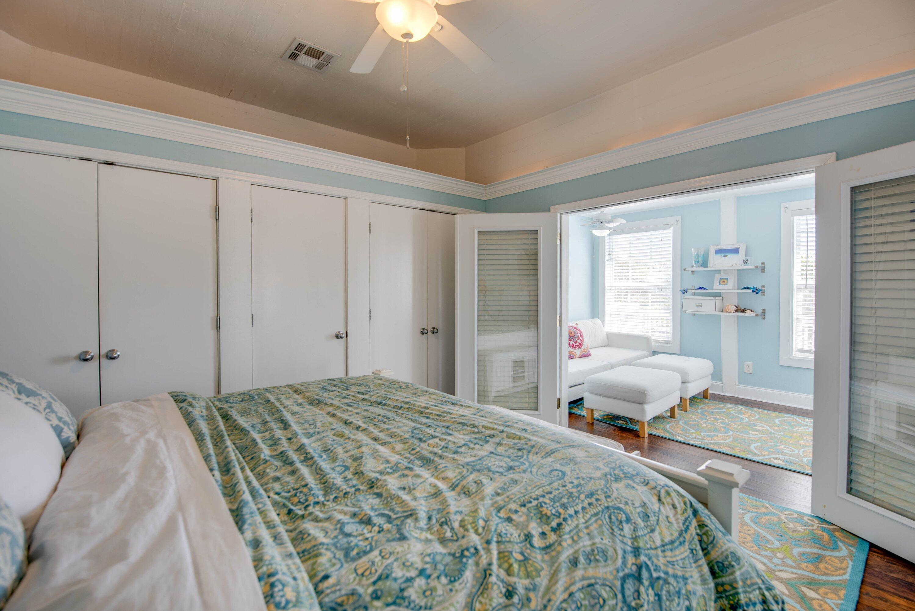 828 White Street, Unit 1 Key West, FL 33040 - Photo 20 of 43 a bedroom with a bed and a chandelier