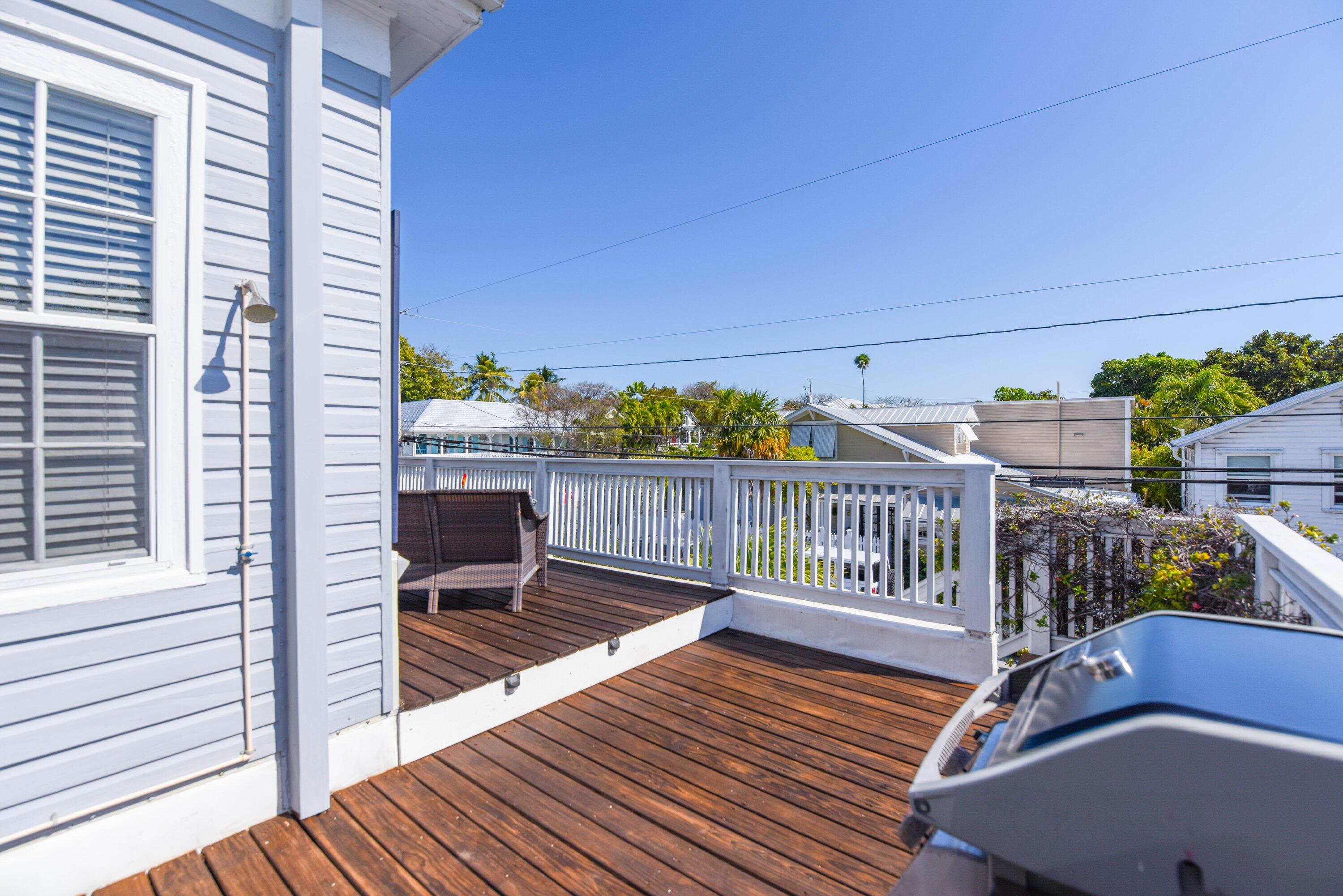 828 White Street, Unit 1 Key West, FL 33040 - Photo 39 of 43 a view of a balcony with chairs